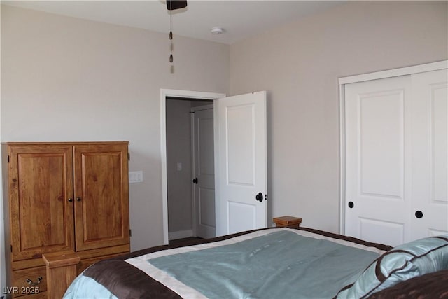 bedroom with a closet and baseboards