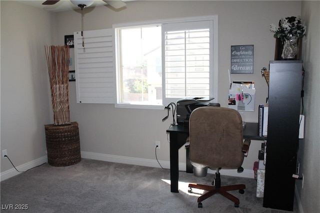 office area featuring ceiling fan, carpet flooring, and baseboards