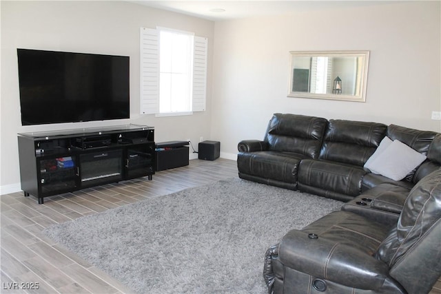 living area with wood finish floors and baseboards