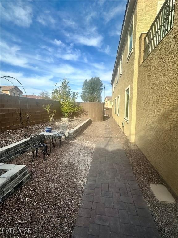 view of yard featuring a patio area and a fenced backyard