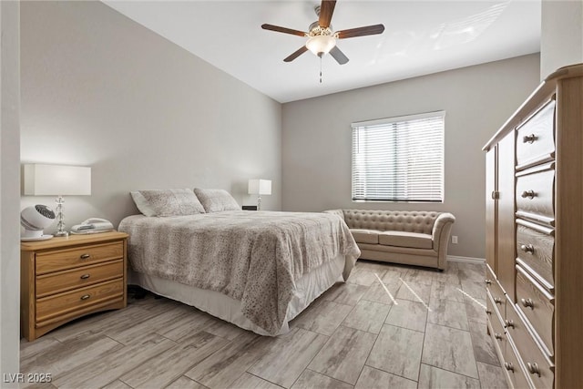 bedroom with wood finish floors, ceiling fan, and baseboards