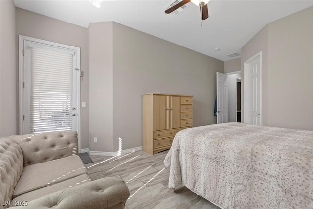 bedroom with vaulted ceiling, baseboards, and ceiling fan