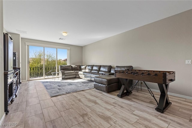 living room featuring visible vents and baseboards