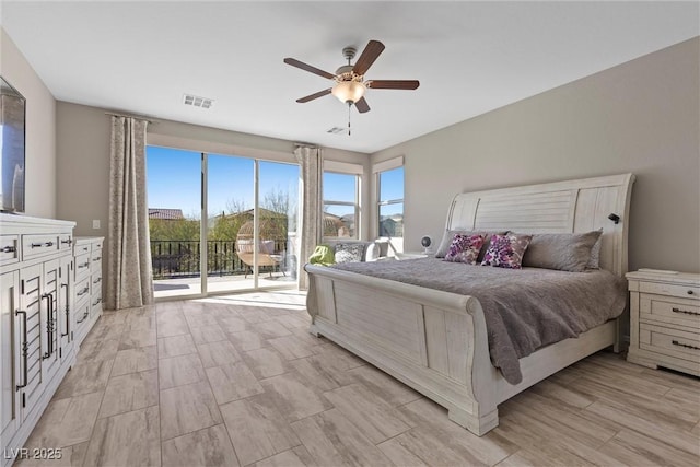 bedroom featuring access to exterior, ceiling fan, and visible vents