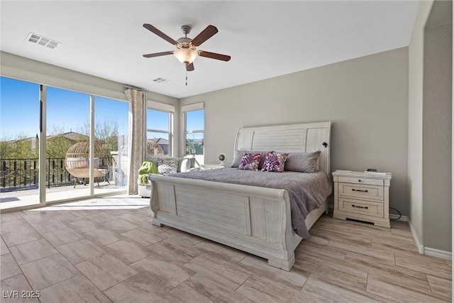 bedroom featuring access to outside, visible vents, ceiling fan, and baseboards