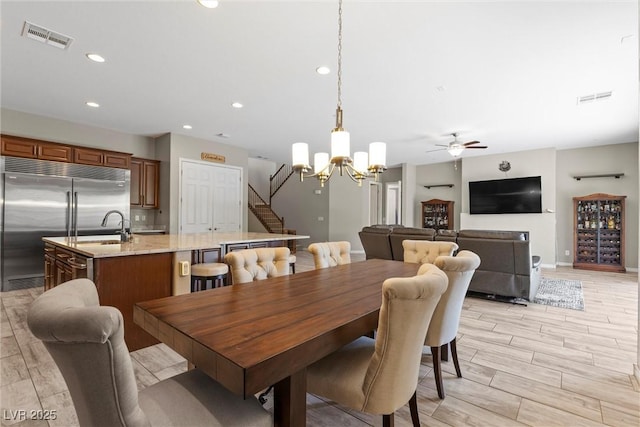 dining space featuring wood finish floors, visible vents, and recessed lighting