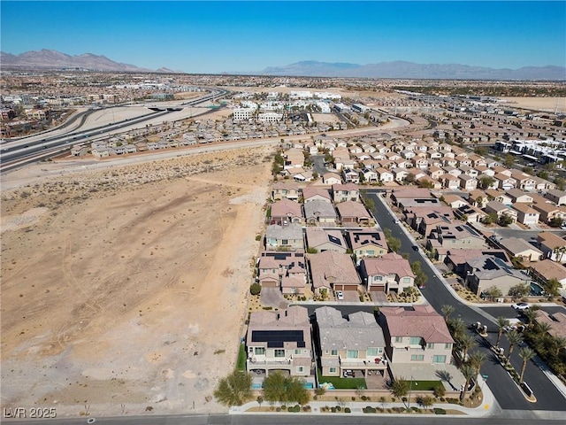 birds eye view of property featuring a residential view and a mountain view