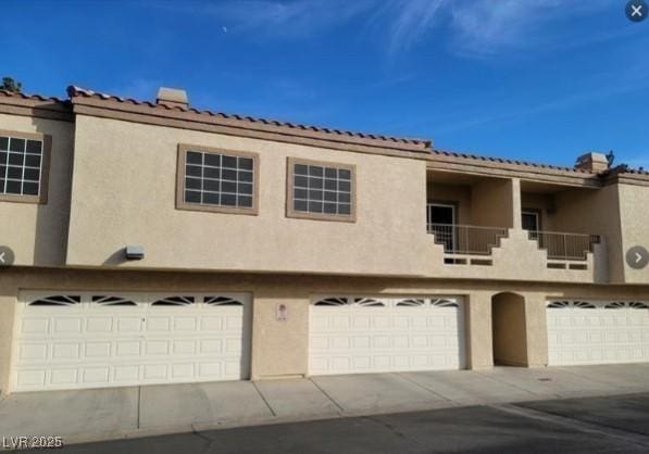 view of home's exterior with a garage and stucco siding