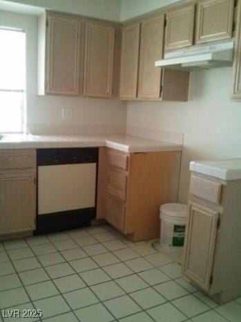 kitchen featuring dishwasher, light countertops, light tile patterned floors, and under cabinet range hood