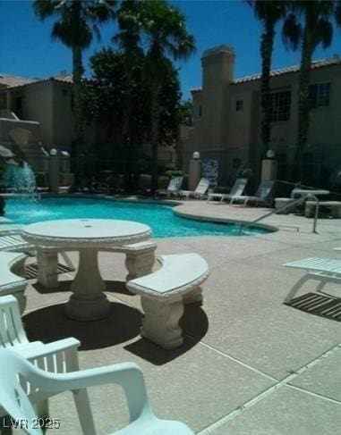 community pool featuring a patio