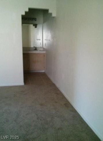 hallway with carpet floors
