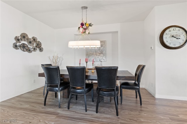 dining room with wood finished floors and baseboards