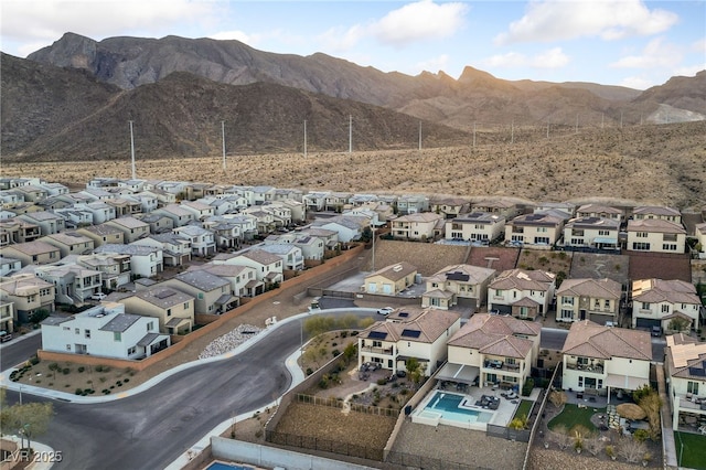 bird's eye view with a residential view and a mountain view