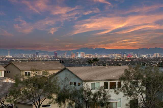 property's view of city with a mountain view