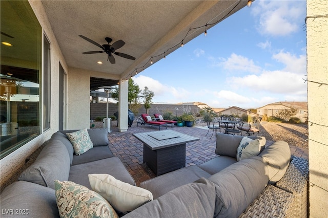 view of patio / terrace with ceiling fan, an outdoor hangout area, a fenced backyard, and outdoor dining space