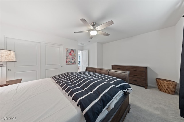 bedroom with carpet floors, ceiling fan, and a closet