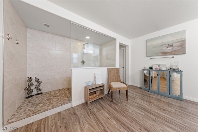 interior space featuring baseboards and wood finished floors