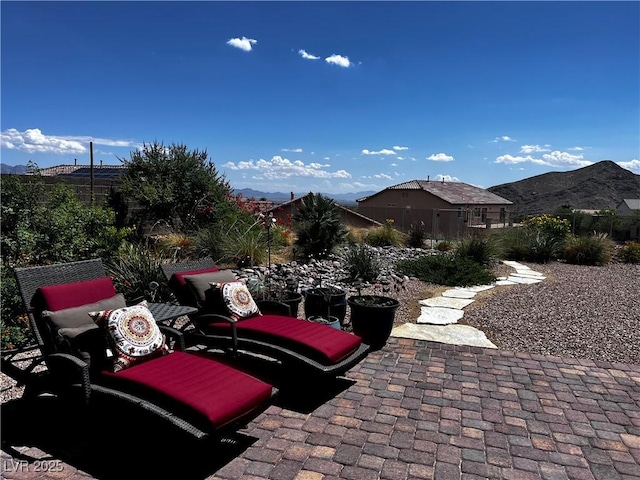 view of patio / terrace featuring a mountain view