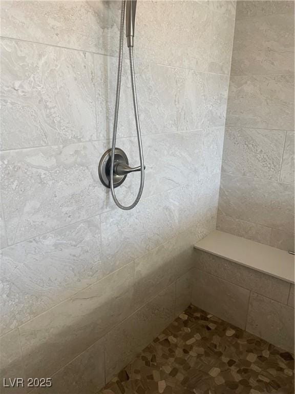 room details featuring tiled shower