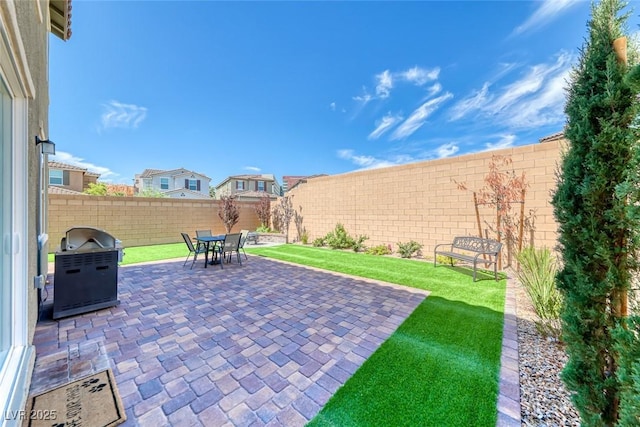 view of patio / terrace with a fenced backyard and area for grilling