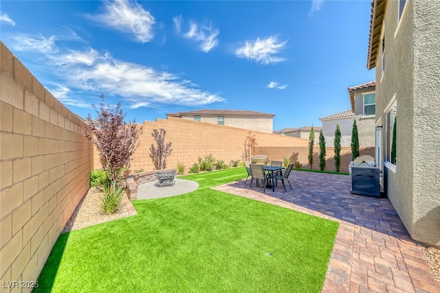 view of yard with a fenced backyard and a patio