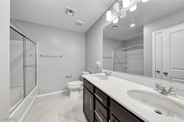 full bathroom featuring tile patterned flooring, a sink, and visible vents