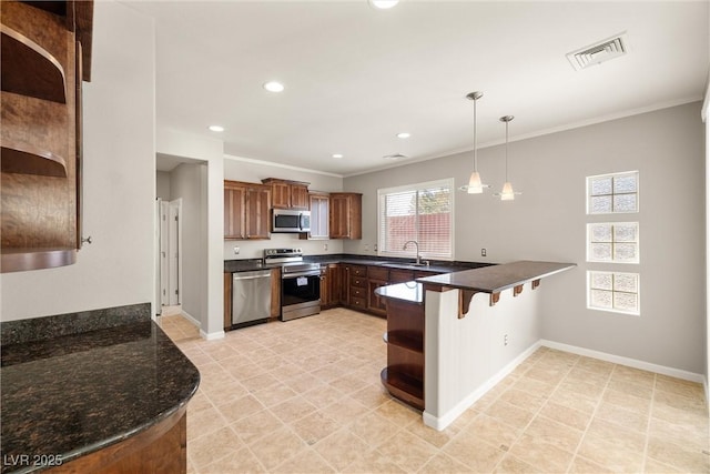 kitchen featuring open shelves, stainless steel appliances, a sink, visible vents, and a peninsula