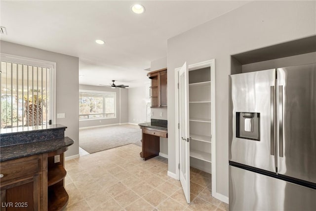 kitchen featuring a ceiling fan, open shelves, stainless steel fridge with ice dispenser, baseboards, and recessed lighting