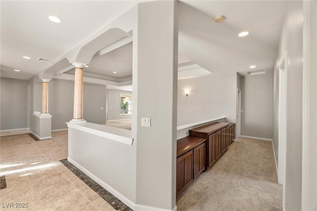 corridor with decorative columns, recessed lighting, baseboards, and visible vents
