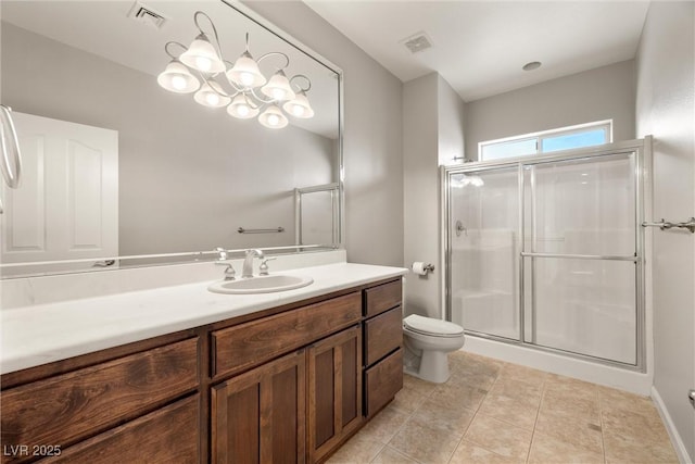bathroom featuring visible vents, a stall shower, toilet, and vanity