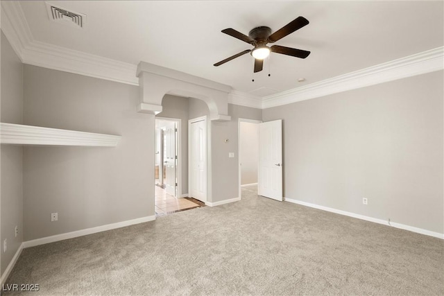 unfurnished room with baseboards, visible vents, carpet floors, and a ceiling fan
