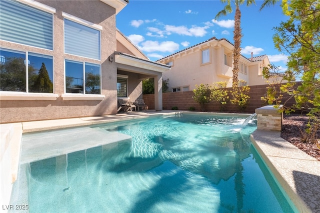 view of swimming pool featuring a fenced in pool and fence