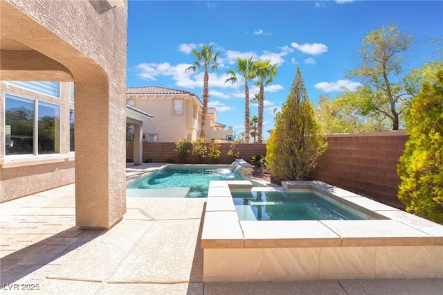 view of pool with a fenced in pool, a patio area, a fenced backyard, and an in ground hot tub