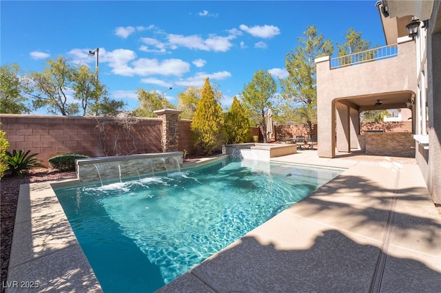 view of swimming pool featuring a fenced in pool, a fenced backyard, and a patio