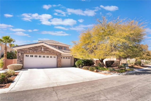 view of front facade with stucco siding, concrete driveway, an attached garage, fence, and stone siding