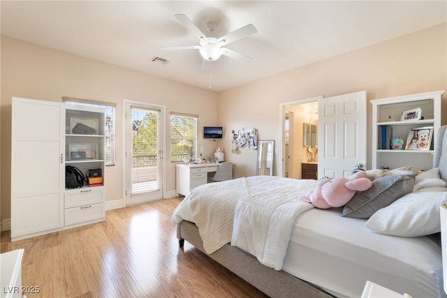 bedroom with visible vents, light wood-style flooring, ceiling fan, ensuite bath, and access to outside