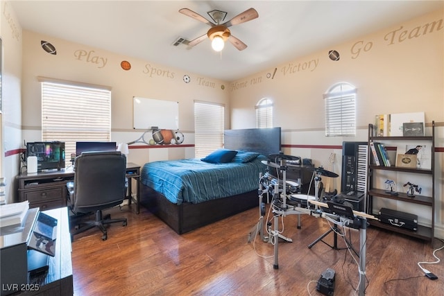 bedroom with visible vents and wood finished floors