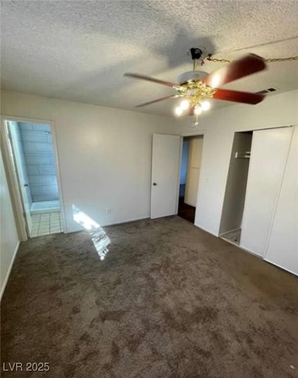 unfurnished bedroom with a textured ceiling, a ceiling fan, and carpet flooring