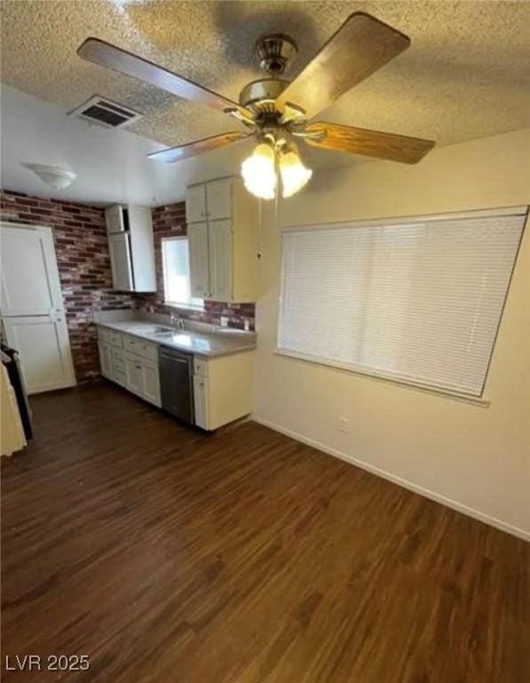 kitchen with visible vents, dark wood-type flooring, ceiling fan, a textured ceiling, and dishwasher