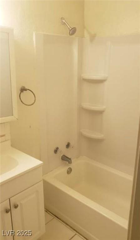 bathroom with shower / bathing tub combination, tile patterned flooring, and vanity