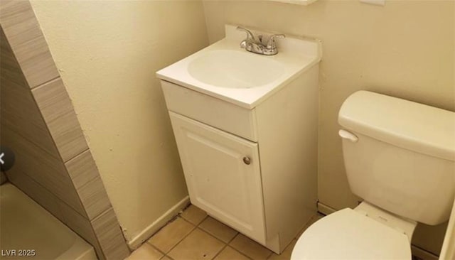 bathroom featuring toilet, tile patterned flooring, a shower, and vanity