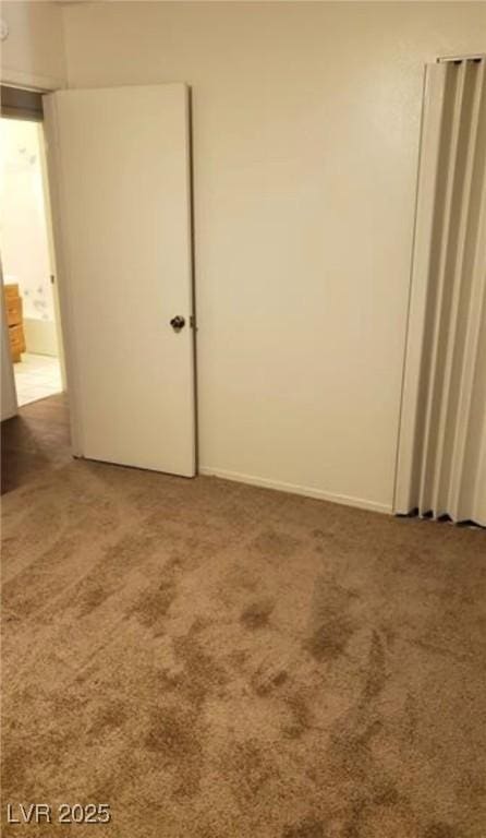 spare room with carpet flooring