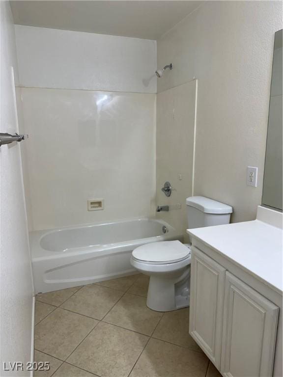 full bathroom with washtub / shower combination, vanity, toilet, and tile patterned floors