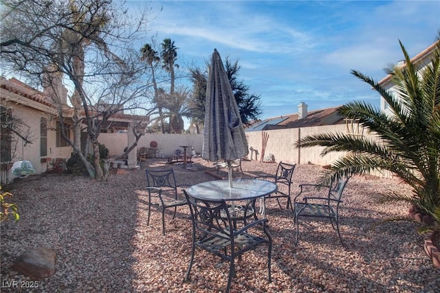 view of yard with a fenced backyard and a patio