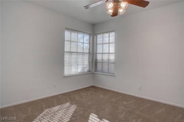 empty room featuring ceiling fan, carpet flooring, and baseboards