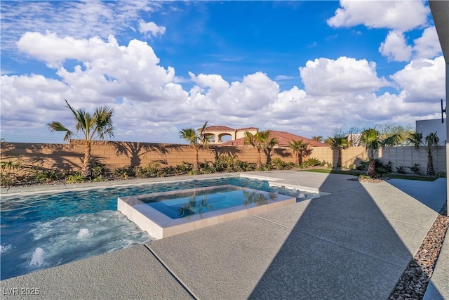 view of pool with a pool with connected hot tub and a fenced backyard