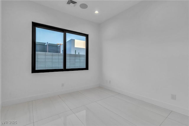 unfurnished room with baseboards, visible vents, tile patterned flooring, and recessed lighting