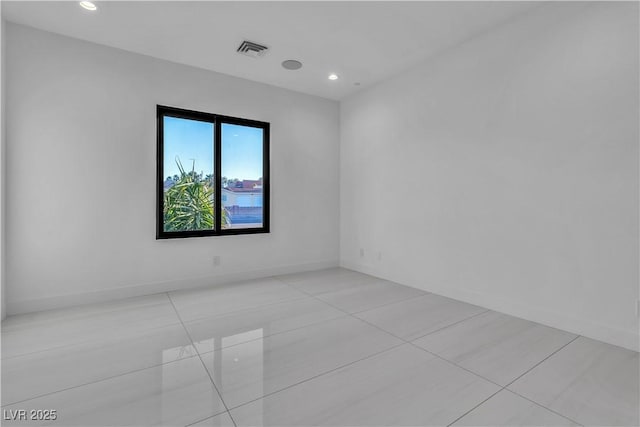 unfurnished room featuring recessed lighting, visible vents, baseboards, and light tile patterned floors