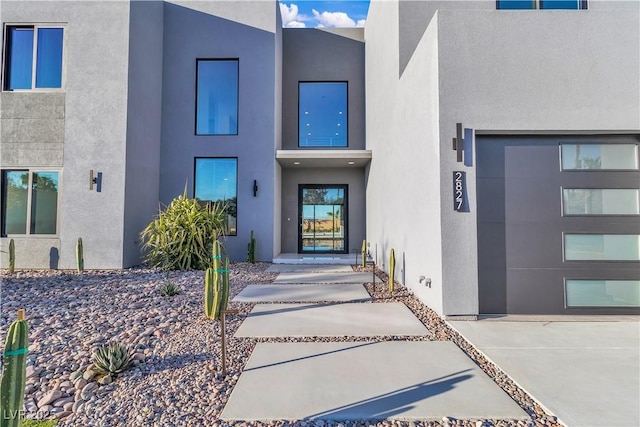 property entrance with stucco siding