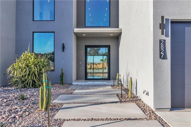 doorway to property with stucco siding